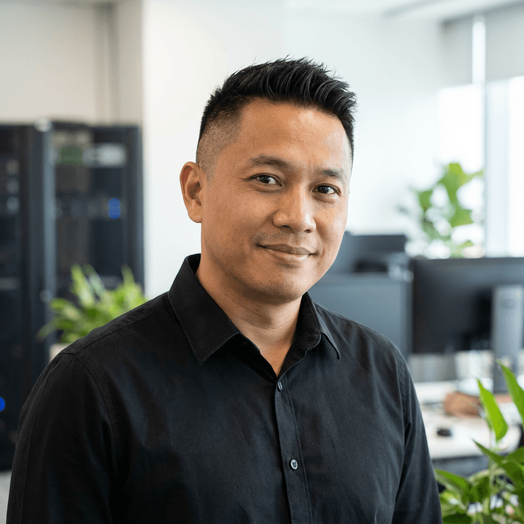 Male IT consultant in his early 40s in a casual office setting